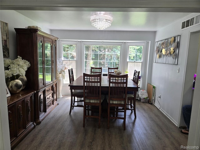 17328 Mcnamara Dr, Garden City, MI 48152 - dining area featuring dark wood-type flooring and a chandelier