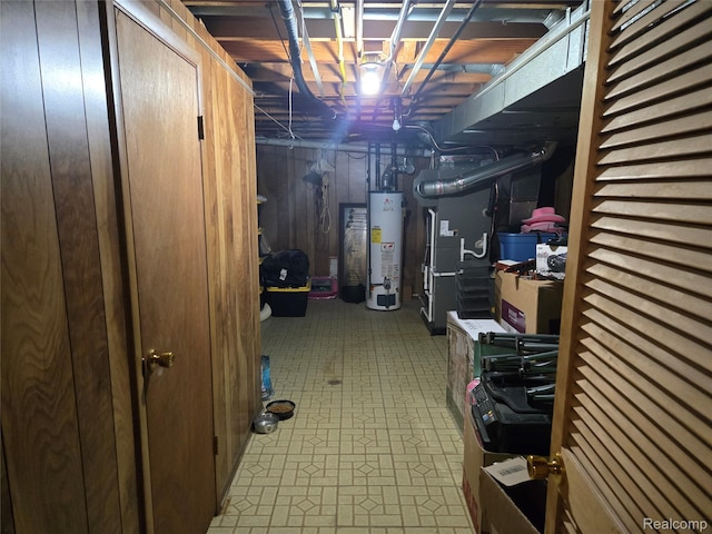 17328 Mcnamara Dr, Garden City, MI 48152 - unfinished basement featuring gas water heater, tile patterned floors, and heating unit