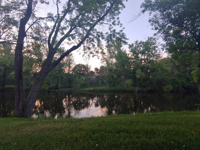 524 S Cherry St, Evart, MI 49631 - water view featuring a forest