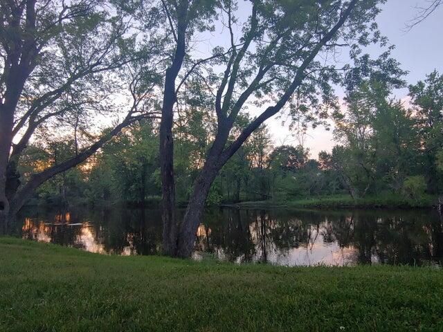 524 S Cherry St, Evart, MI 49631 - water view featuring a heavily wooded area