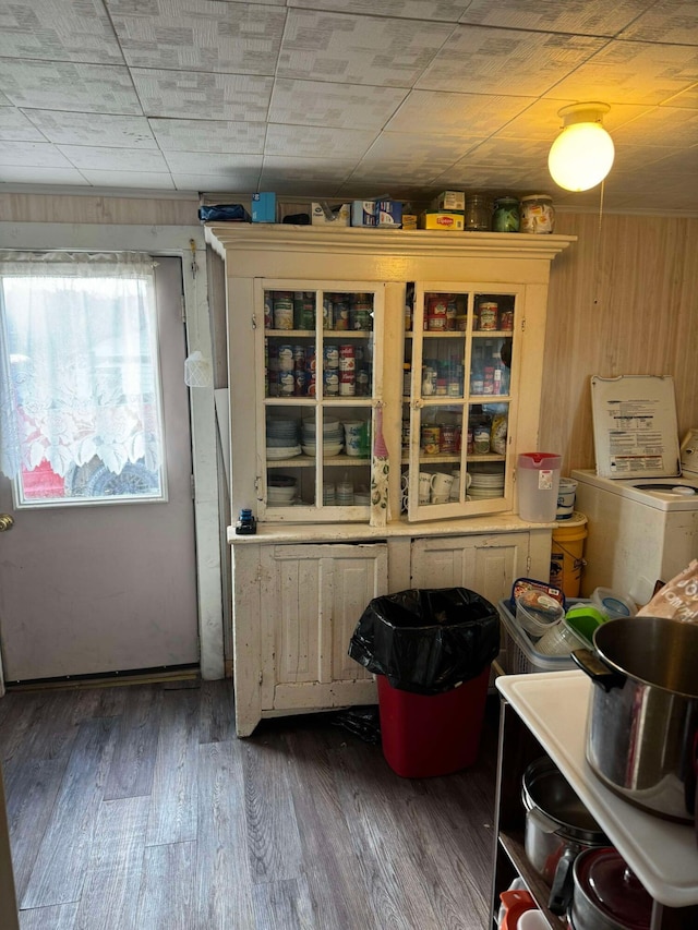 524 S Cherry St, Evart, MI 49631 - kitchen featuring washer / clothes dryer, wood finished floors, and glass insert cabinets