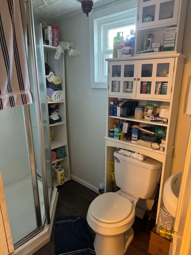 524 S Cherry St, Evart, MI 49631 - bathroom featuring a stall shower and wood finished floors