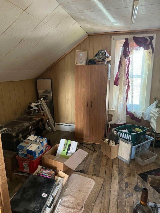 524 S Cherry St, Evart, MI 49631 - additional living space featuring lofted ceiling, hardwood / wood-style flooring, and wooden walls
