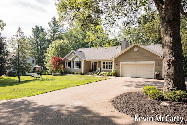 530 Pine Haven Dr, Comstock Park, MI 49321 - ranch-style house featuring concrete driveway, an attached garage, a front yard, and a chimney