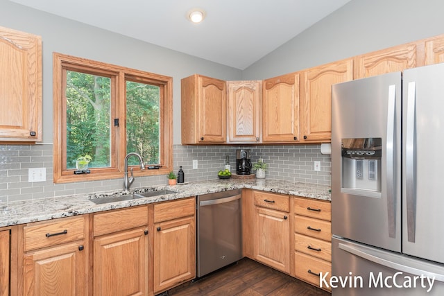 530 Pine Haven Dr, Comstock Park, MI 49321 - kitchen with stainless steel appliances, lofted ceiling, dark wood finished floors, light stone countertops, and backsplash