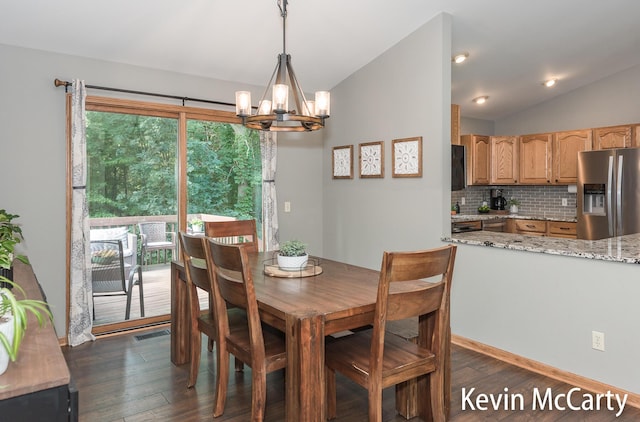 530 Pine Haven Dr, Comstock Park, MI 49321 - dining space with dark wood-type flooring, a chandelier, and lofted ceiling