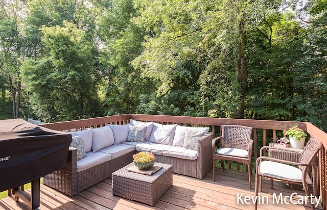 530 Pine Haven Dr, Comstock Park, MI 49321 - wooden deck featuring an outdoor hangout area and a forest view