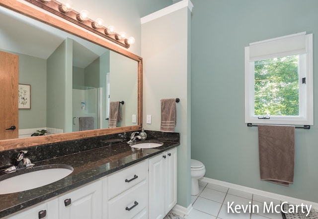 530 Pine Haven Dr, Comstock Park, MI 49321 - full bath with double vanity, tile patterned flooring, and an enclosed shower