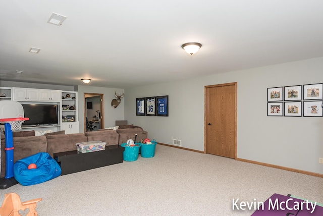 530 Pine Haven Dr, Comstock Park, MI 49321 - carpeted living area featuring baseboards and built in features