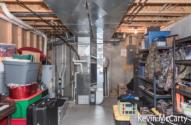 530 Pine Haven Dr, Comstock Park, MI 49321 - unfinished below grade area with water heater, electric panel, and heating unit
