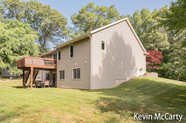 530 Pine Haven Dr, Comstock Park, MI 49321 - back of house featuring stairs, a wooden deck, and a yard