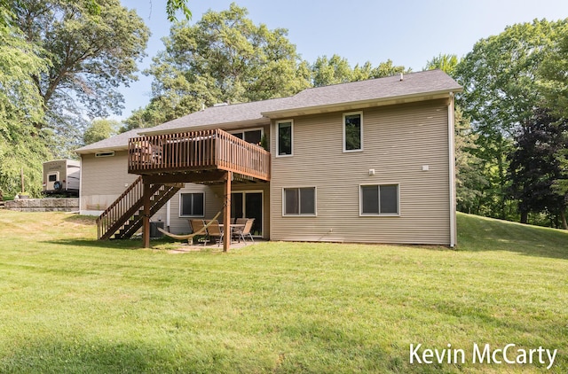 530 Pine Haven Dr, Comstock Park, MI 49321 - rear view of property featuring a deck, stairs, a lawn, and a patio
