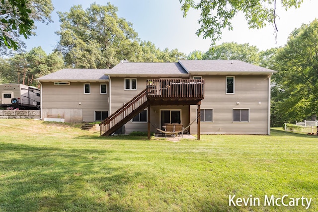 530 Pine Haven Dr, Comstock Park, MI 49321 - rear view of property with stairs, a wooden deck, and a yard