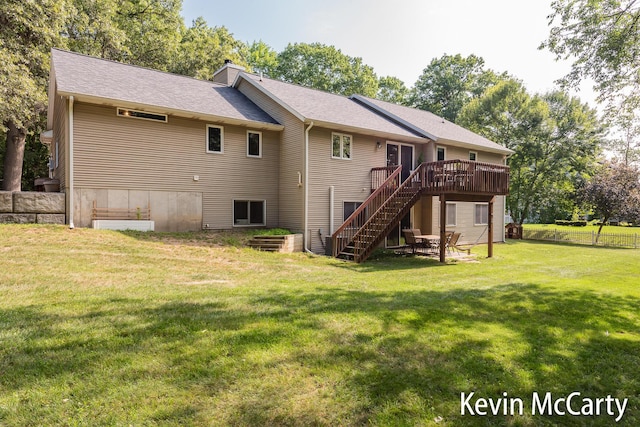 530 Pine Haven Dr, Comstock Park, MI 49321 - rear view of house featuring a wooden deck, stairway, a chimney, and a patio area