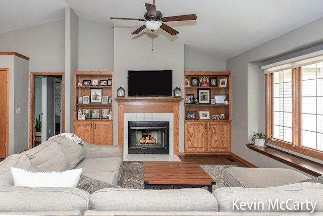 530 Pine Haven Dr, Comstock Park, MI 49321 - living area featuring lofted ceiling, wood finished floors, a fireplace, and ceiling fan