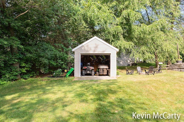 530 Pine Haven Dr, Comstock Park, MI 49321 - view of grassy yard featuring an outbuilding and a garage