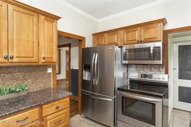 14711 Borgman St, Oak Park, MI 48237 - kitchen with stainless steel appliances, light tile patterned floors, tasteful backsplash, ornamental molding, and dark stone counters