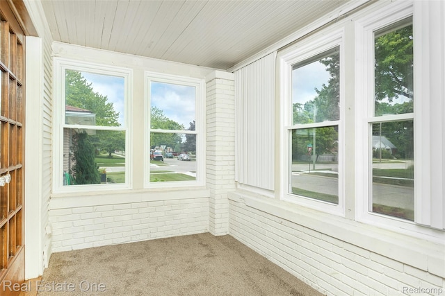 14711 Borgman St, Oak Park, MI 48237 - unfurnished sunroom featuring carpet floors, wood walls, and wooden ceiling