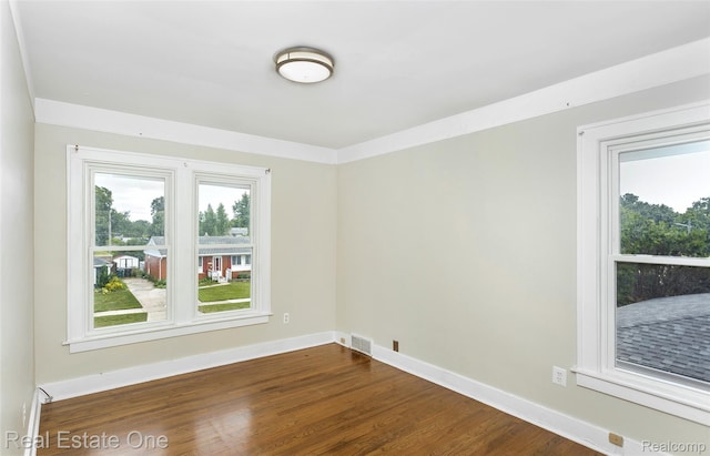 14711 Borgman St, Oak Park, MI 48237 - unfurnished room with dark wood-type flooring and baseboards