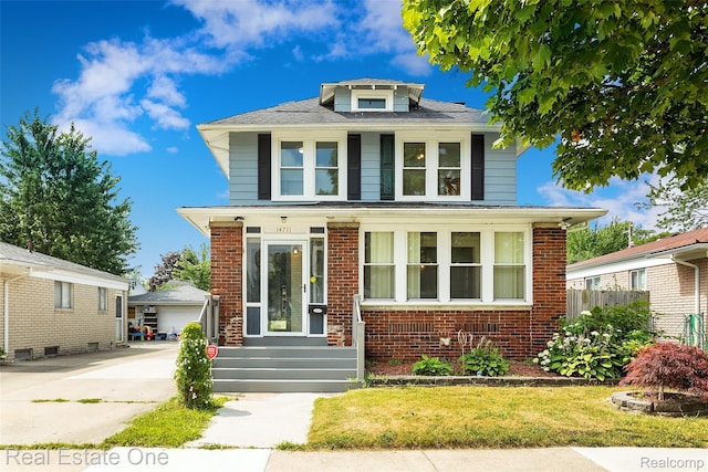 14711 Borgman St, Oak Park, MI 48237 - american foursquare style home featuring brick siding, a garage, and an outdoor structure