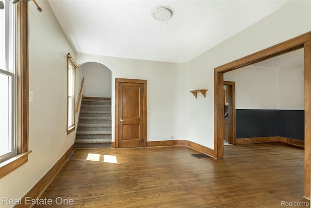 14711 Borgman St, Oak Park, MI 48237 - empty room featuring wood finished floors, a textured ceiling, and stairs