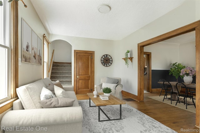 14711 Borgman St, Oak Park, MI 48237 - living area with wood finished floors, a textured ceiling, and stairs