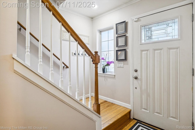 21203 Collingham Ave, Farmington Hills, MI 48336 - foyer entrance featuring wood finished floors, stairs, and ornamental molding
