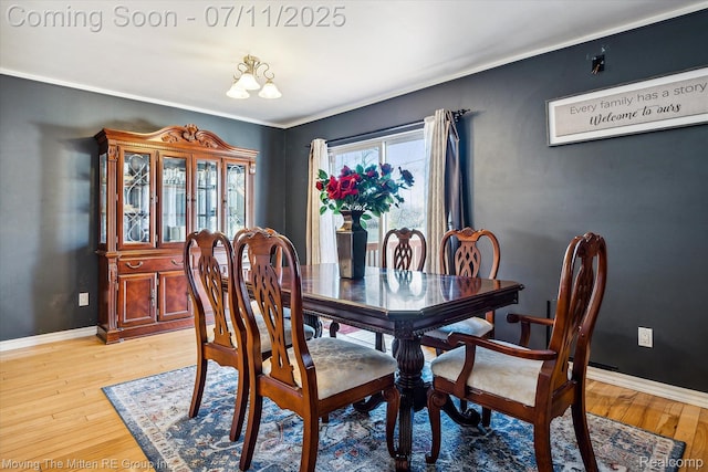 21203 Collingham Ave, Farmington Hills, MI 48336 - dining room with light wood-type flooring and crown molding