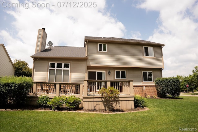 6020 Majestic Oaks Dr, Commerce Twp, MI 48382 - back of house with a chimney, a deck, and a yard