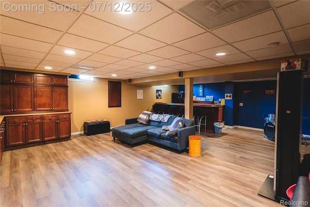 6020 Majestic Oaks Dr, Commerce Twp, MI 48382 - living room with light wood-style flooring, a paneled ceiling, and recessed lighting