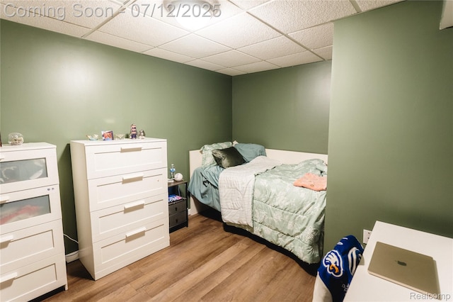 6020 Majestic Oaks Dr, Commerce Twp, MI 48382 - bedroom with a paneled ceiling and light wood-style floors