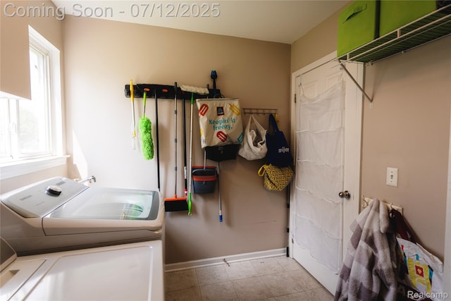 6020 Majestic Oaks Dr, Commerce Twp, MI 48382 - laundry area with washer and dryer and baseboards