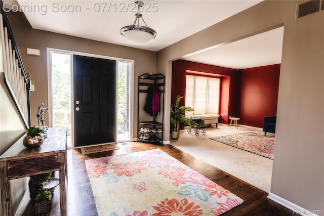 6020 Majestic Oaks Dr, Commerce Twp, MI 48382 - foyer entrance featuring healthy amount of natural light and wood finished floors