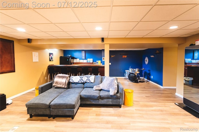6020 Majestic Oaks Dr, Commerce Twp, MI 48382 - living area with wood finished floors, a drop ceiling, and recessed lighting