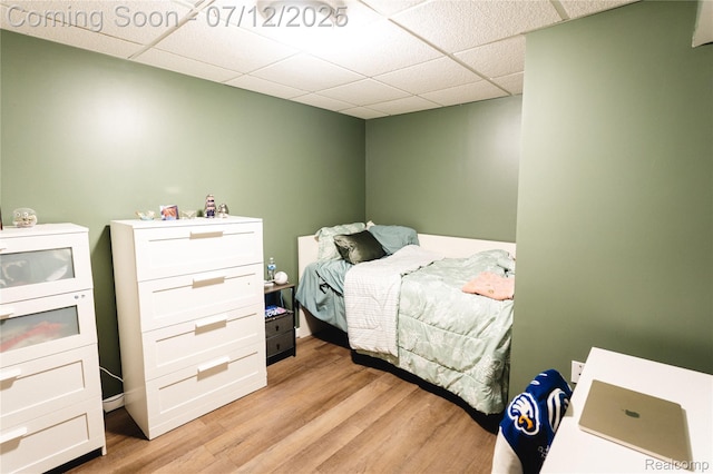 6020 Majestic Oaks Dr, Commerce Twp, MI 48382 - bedroom with a drop ceiling and light wood-style floors
