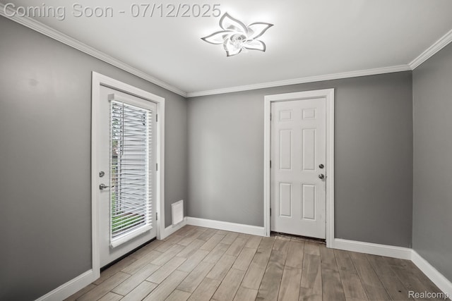 3811 Benstein Rd, Commerce Twp, MI 48382 - foyer entrance featuring crown molding and wood finished floors