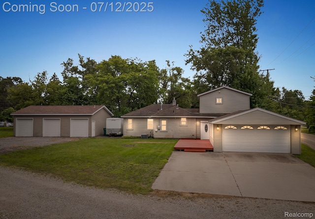 3811 Benstein Rd, Commerce Twp, MI 48382 - view of front of house with a front lawn, an outbuilding, and a wooden deck
