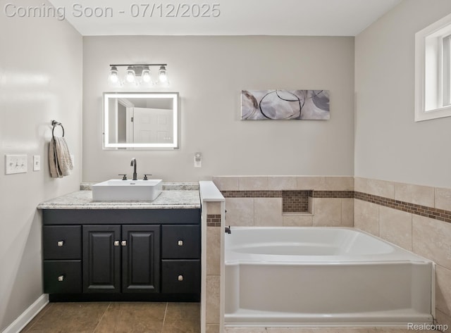3811 Benstein Rd, Commerce Twp, MI 48382 - full bath featuring vanity, a bath, and tile patterned flooring