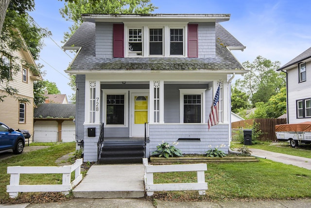 728 Fifth St, Jackson, MI 49203 - bungalow-style house with covered porch and roof with shingles