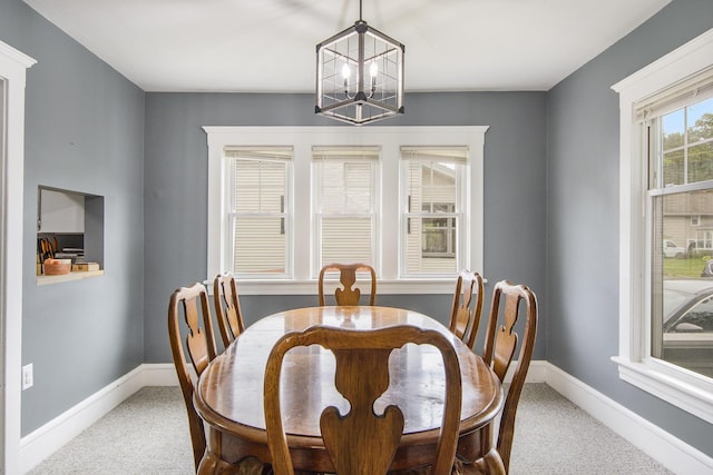 728 Fifth St, Jackson, MI 49203 - dining room with a chandelier and carpet flooring