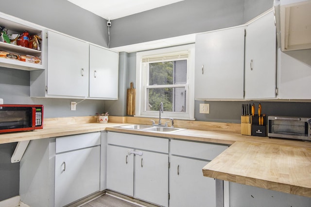 728 Fifth St, Jackson, MI 49203 - kitchen with white cabinetry