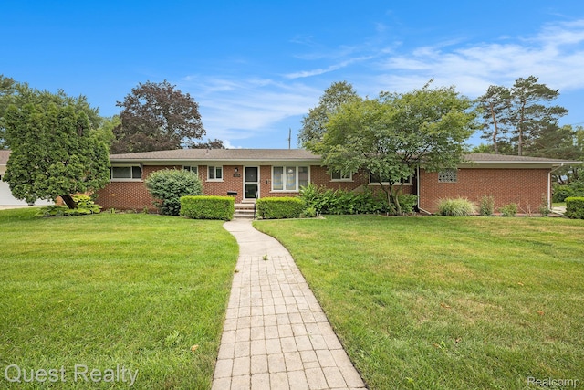 31618 Winchester Ave, Warren, MI 48092 - ranch-style house with a front yard and brick siding