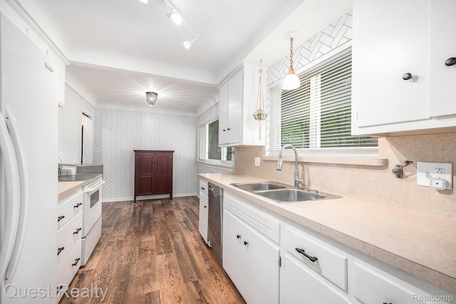 31618 Winchester Ave, Warren, MI 48092 - kitchen featuring white appliances, wallpapered walls, light countertops, white cabinets, and dark wood finished floors