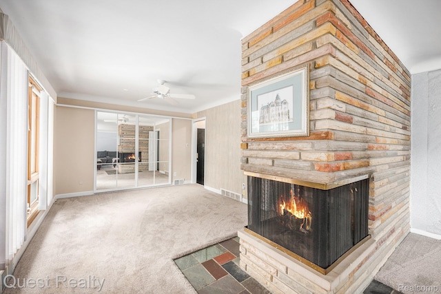 31618 Winchester Ave, Warren, MI 48092 - unfurnished living room featuring a multi sided fireplace, a ceiling fan, and carpet flooring