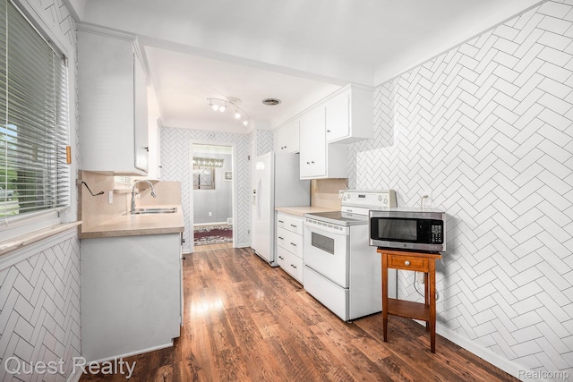 31618 Winchester Ave, Warren, MI 48092 - kitchen featuring white appliances, light countertops, white cabinetry, and wood finished floors