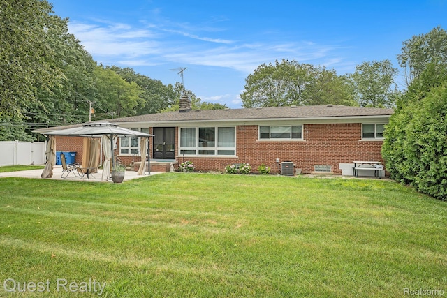31618 Winchester Ave, Warren, MI 48092 - rear view of property featuring a gazebo, a patio, brick siding, and a chimney