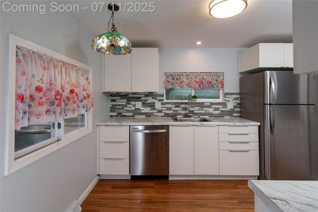 3110 Brisbane St, Walled Lake, MI 48390 - kitchen featuring stainless steel appliances, backsplash, white cabinets, hanging light fixtures, and recessed lighting