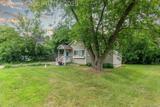 3110 Brisbane St, Walled Lake, MI 48390 - view of front of property featuring a front yard and view of wooded area