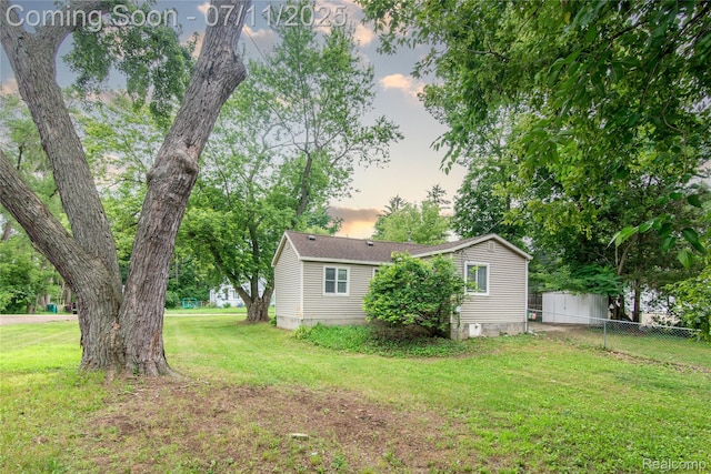 3110 Brisbane St, Walled Lake, MI 48390 - view of yard at dusk