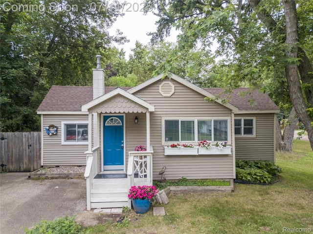 3110 Brisbane St, Walled Lake, MI 48390 - bungalow-style house with a chimney and roof with shingles